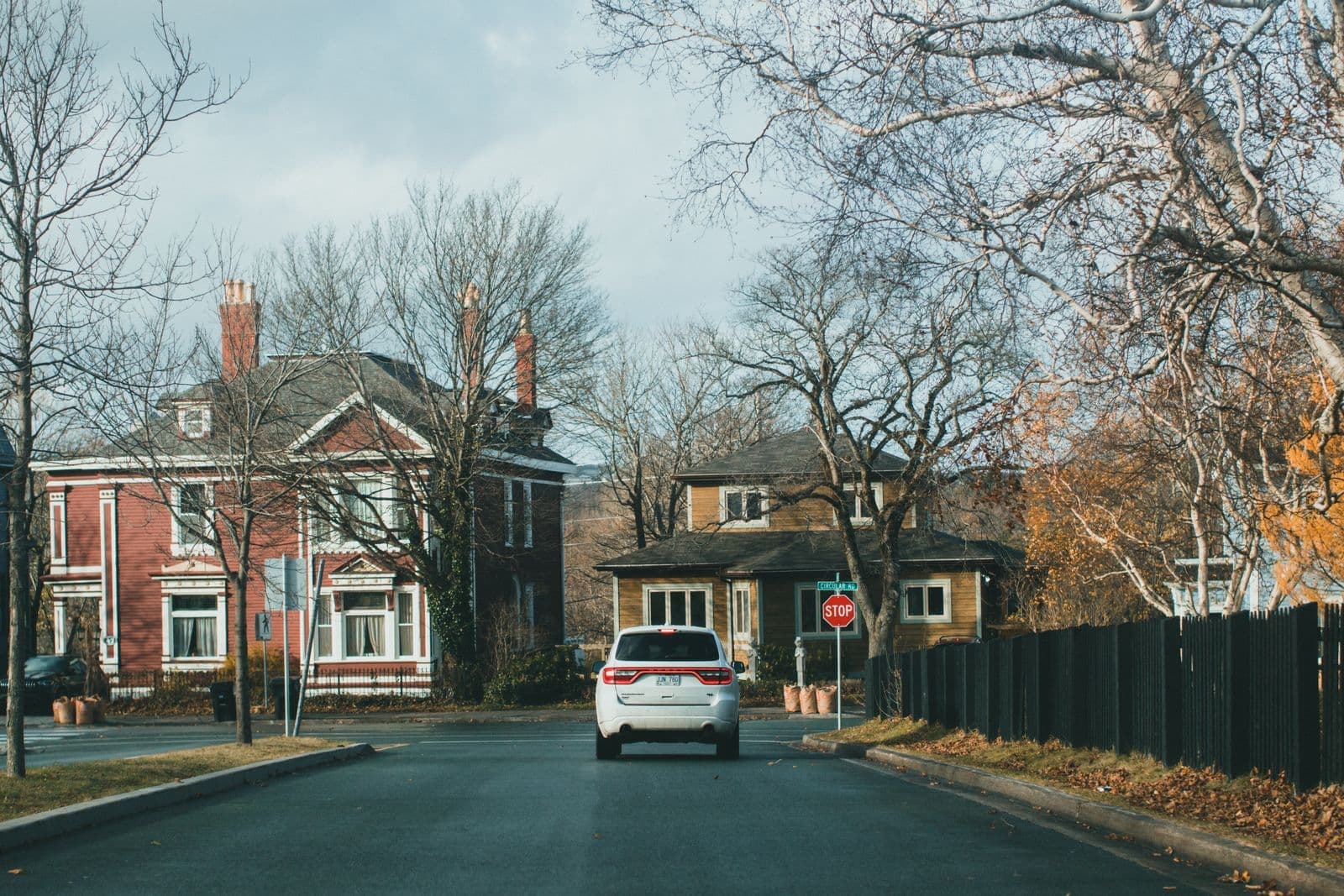 Brick houses on a quiet suburban street in autumn